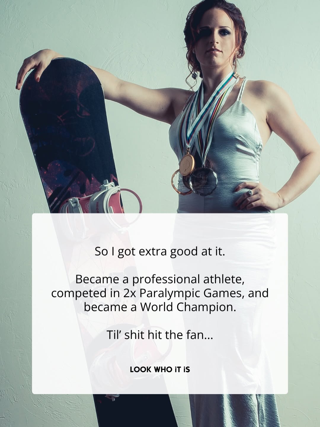 Nicole Roundy wearing medals beside a snowboard.